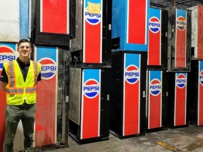 Taylor stands in front of old PepsiCo equipment