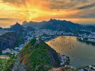 Aerial photo of the city of Rio de Janeiro, Brazil, with mountains and coastline in the distance