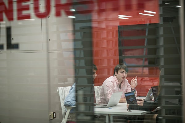 Rob Karp ’19 working with his team at eLab with Entrepreneurship at Cornell