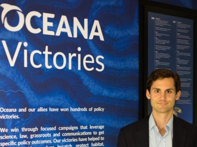 Russell in front of a wall at Oceana