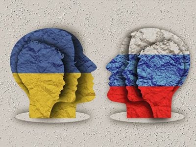 illustration of 3 profiles in the Ukraine flag's colors, blue and yellow, facing 3 profiles in the Russian flag's colors, white, blue, and red.