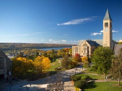 McGraw Tower, Uris Library, Ho Plaza, and Cayuga Lake in fall