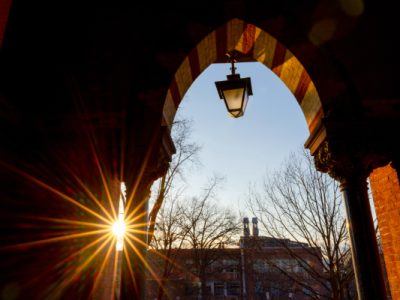 Looking out from Sage Hall with the sun peeking through the doorway.