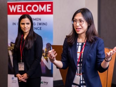 Students present a stock pitch at WIN conference