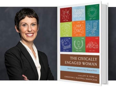 A headshot of a woman with short hair in a suit, next to an enlarged image of a book with a colorful cover.