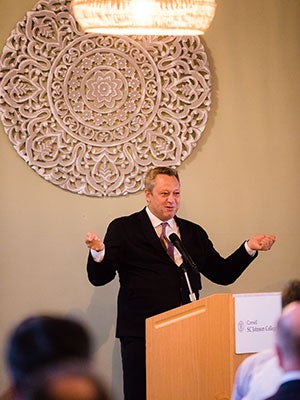 A man at a podium speaking.
