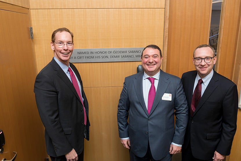 Dean Mark Nelson, Demir Sabanci, and Kevin Hallock, dean of the Cornell SC Johnson College of Business, in Breazzano LL23, next to the plaque honoring Demir&rsquo;s father, during the Sabanci Bridge dedication, Oct. 21, 2019