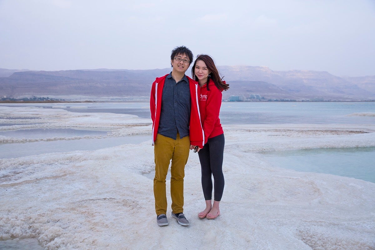 Photo of Izumni and Yifan on a salt formation in the Israeli Dead Sea