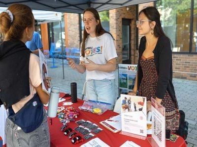 The nonpartisan student group Cornell Votes tables at Welcome Students Weekend, Sept. 14, on the Ithaca Commons.
