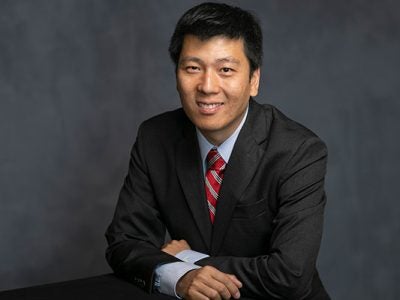 upper body portrait of Wendong Zhang.