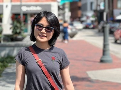 upper body photo of Yichun Hu on a city street.