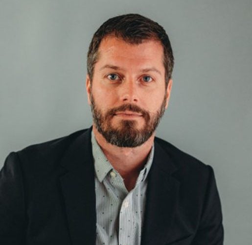 Headshot of Adam Gore.