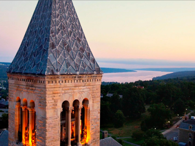 mcgraw tower with aerial view of campus and lake