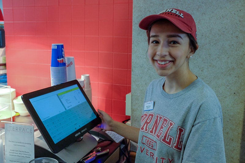 Photo of Alexa working the register at Mac