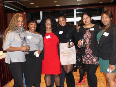 Photo of six women at a reception