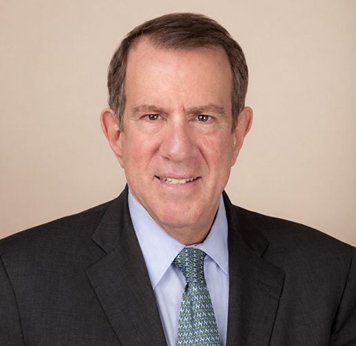 Headshot of Andrew Tisch.