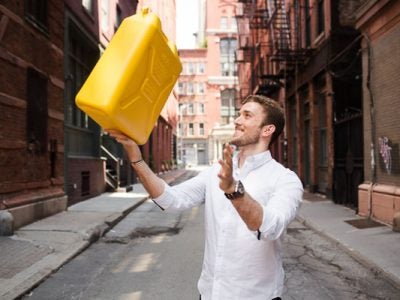 Photo of Antony tossing a water container