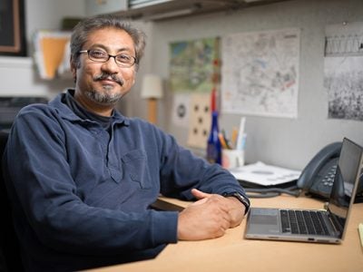 Portrait of Arnab Basu at his desk
