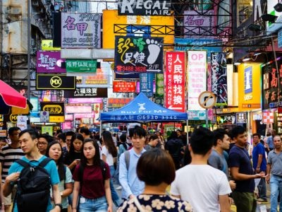 People walking in crowded street in an Asian country
