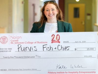 Avery Sheppard holds her first place $25,000 prize.