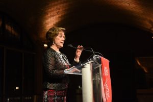 Photo of Anne at a podium