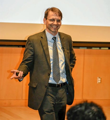 Photo of Bill presenting on stage