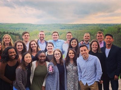 Alt text: Students in the Park Fellows Class of 2020 pose for a group photo at an outdoor event.