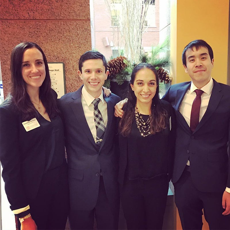 Photo of Brian with three of this MBA colleagues