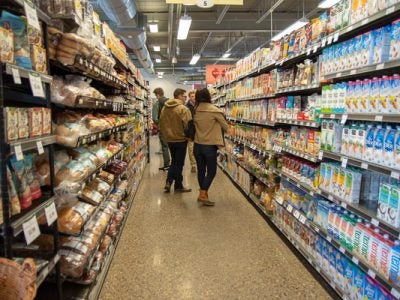 Students in a cooperative grocery store aisle