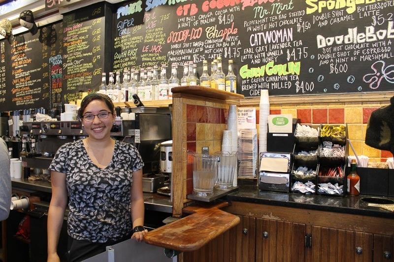 Photo of Claire standing at the service counter at CTB