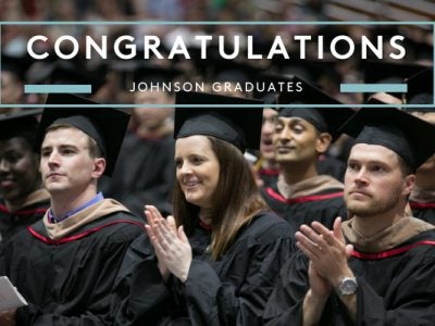 Photo of seated graduates that says Congratulations Johnson graduates