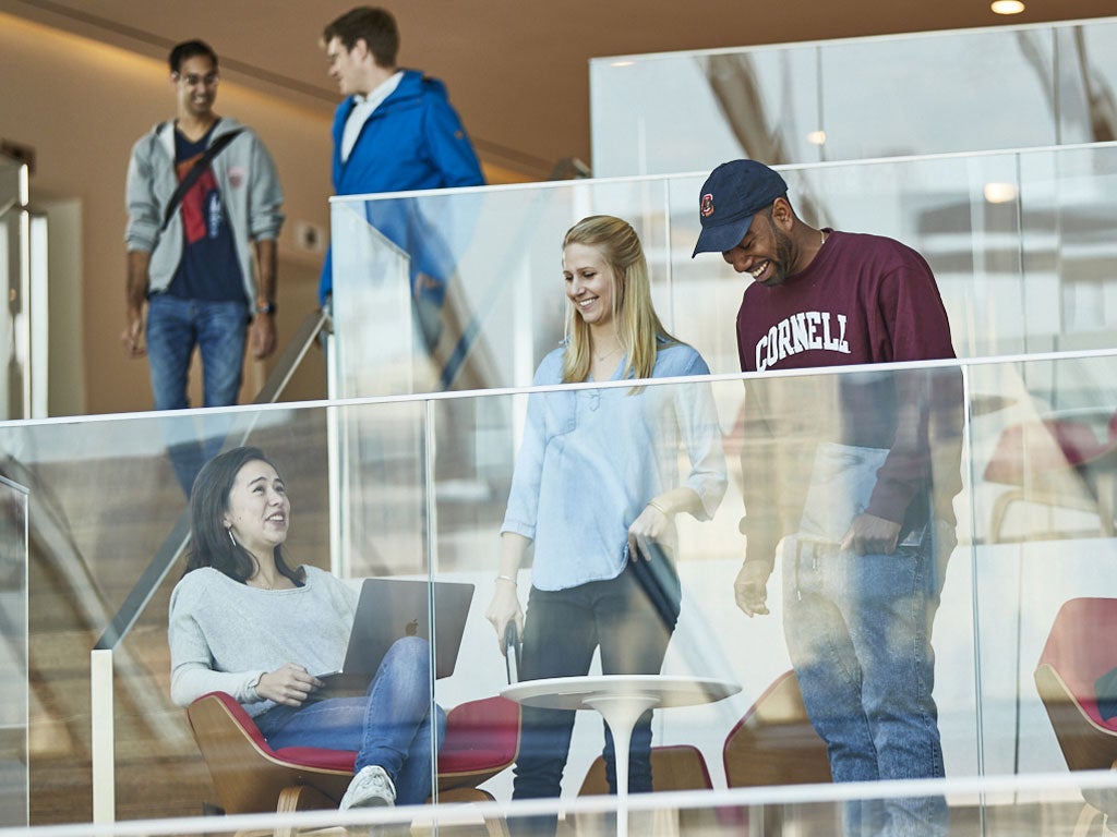 Johnson Cornell Tech MBA students gather to collaborate on a project at the Tata Innovation Center at Cornell Tech's Roosevelt Island campus in Manhattan, NYC.