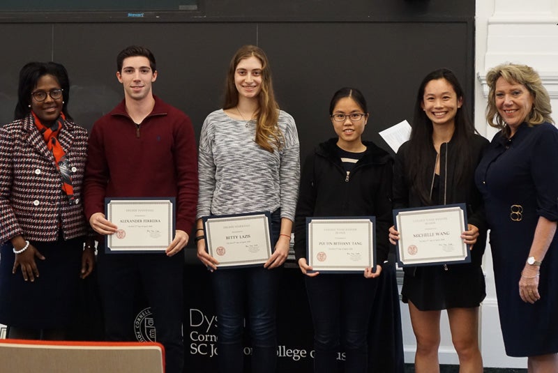 Photo of four students holding certificates