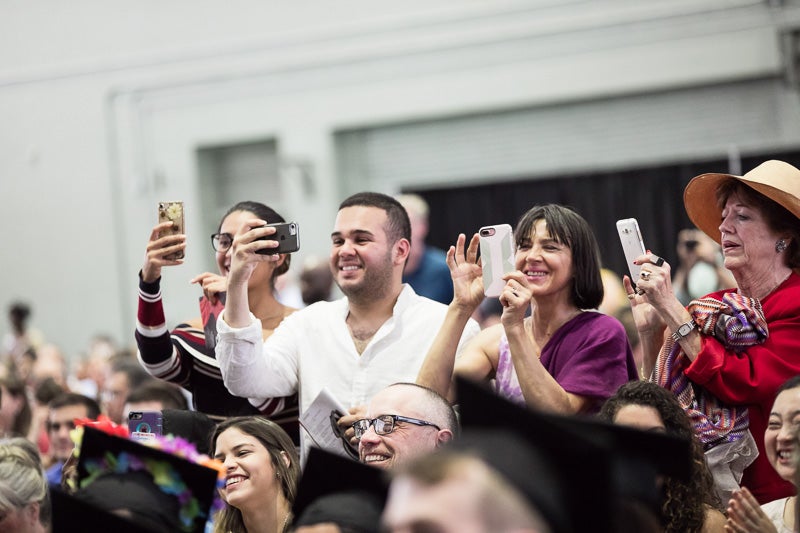 Photo of families taking pictures