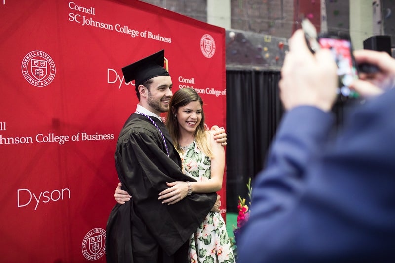 Photo of a graduate with his family