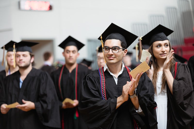 Photo of clapping graduates