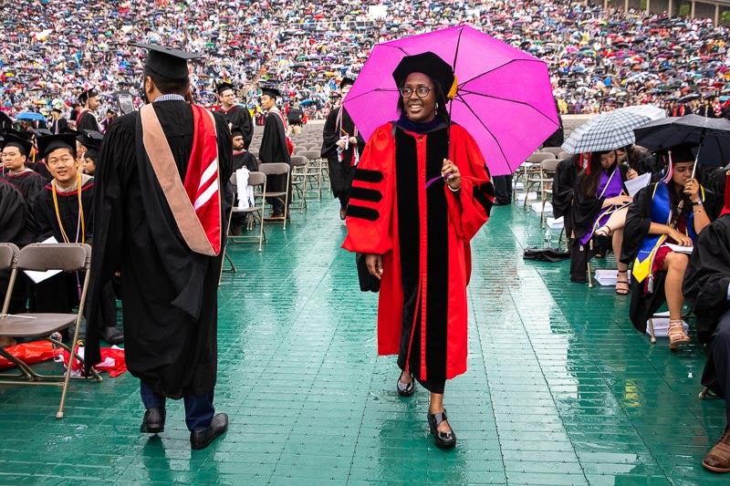 Photo of Dean Wooten holding an umbrella