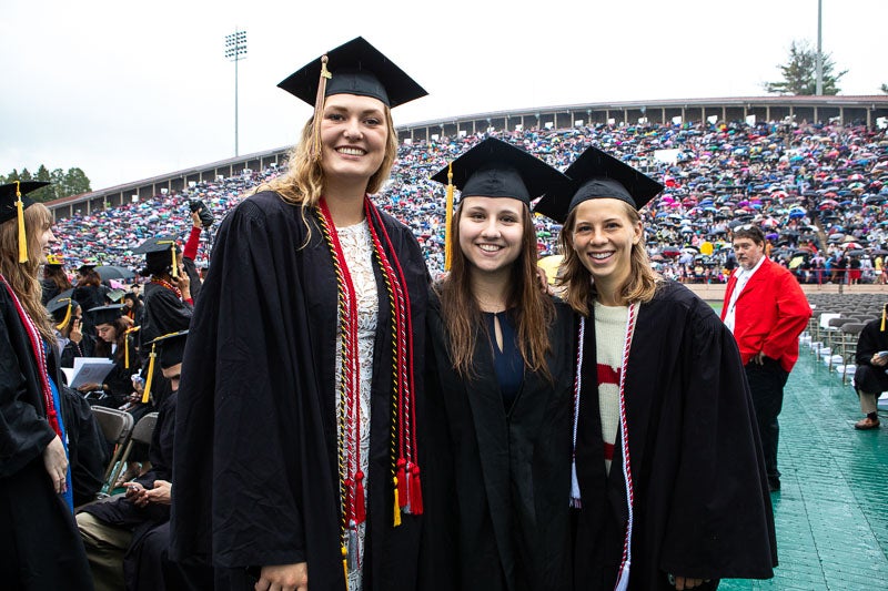 Photo of three graduates