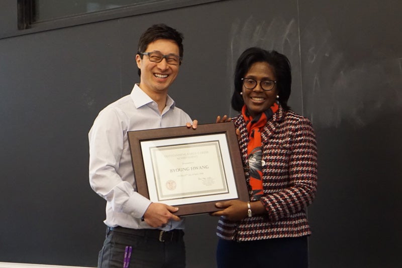 Photo of Byoung and Lynn holding a certificate