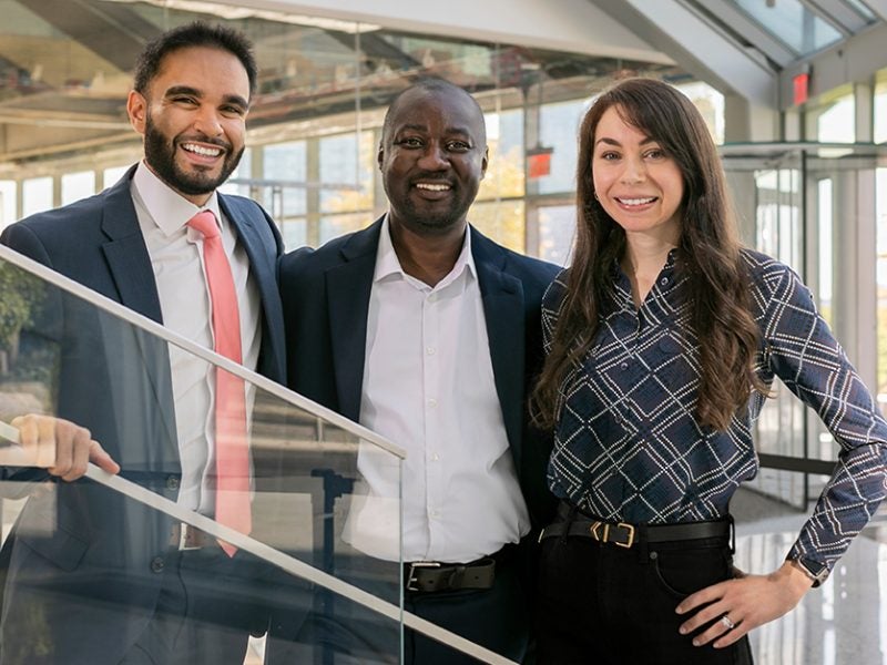 business professionals standing together on stairs