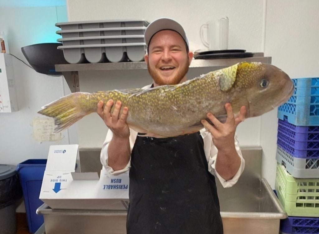Erik Mininsohn holding a fish