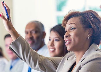 Photo of a woman raising her hand