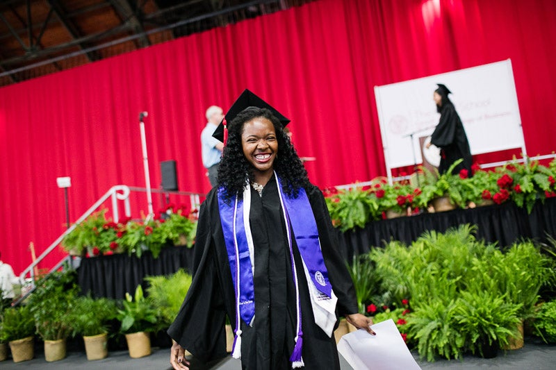 Photo of a smiling graduate