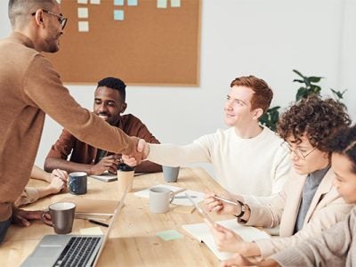 Group of professionals making a business deal.