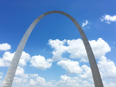 gateway arch monument in front of blue skies