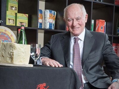 George Gellert poses with products from the Gellert Global Group.