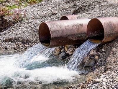 Large piles spill water into a freshwater pool