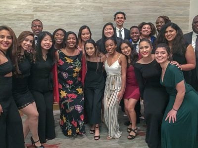 A large group dressed in formal attire
