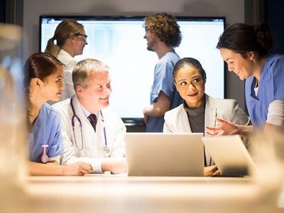Photo of healthcare professionals collaborating around a table