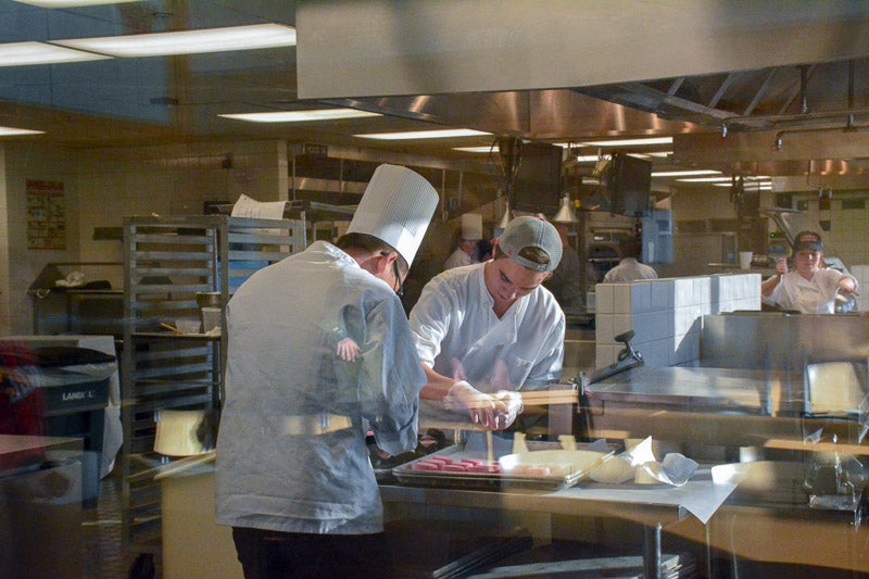 Student chefs working in the kitchen
